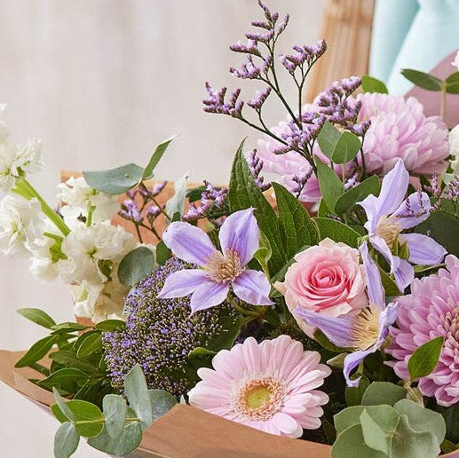 A vintage style bouquet featuring pink roses, purple flowers,Joannes Winchester Florist Delivery Service