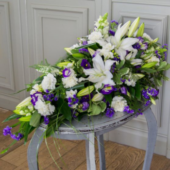 White Lily with Blue and Lime Single Ended Spray to Richard Steel Funerals